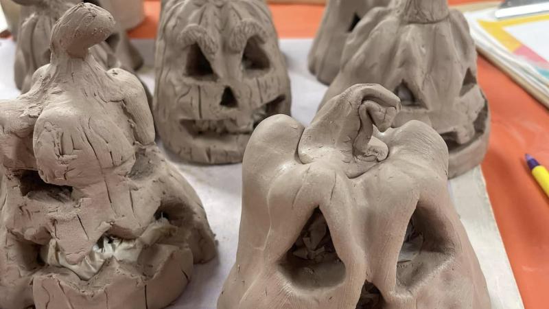 Photo of raw ceramic jack-o-lantern pumpkins.